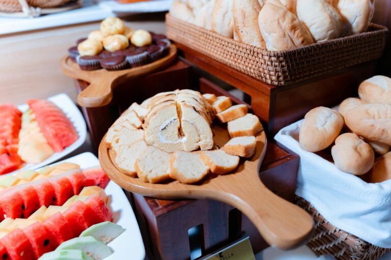 A vibrant buffet with an assortment of fruits, breads, and pastries, perfect for any party.